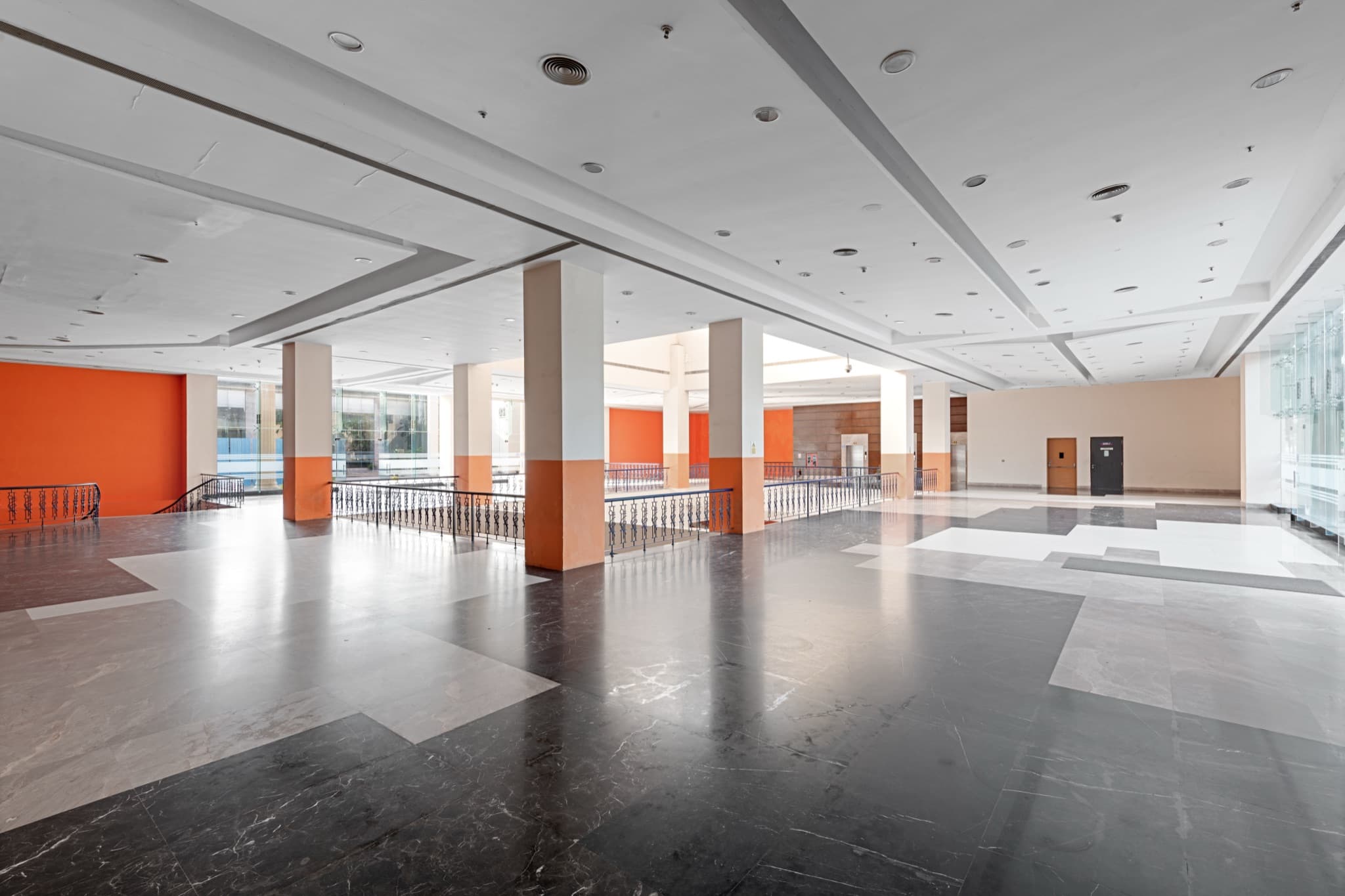 Mezzanine level — polished marble floors and open balustrades